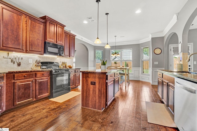 112 Cameron Creek Ln, Simpsonville, SC 29681 - kitchen with black appliances, arched walkways, a decorative wall, dark wood-style floors, and crown molding