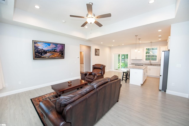 111 Caylee Way, Chesnee, SC 29323 - living area featuring a raised ceiling, light wood-style floors, a ceiling fan, and recessed lighting
