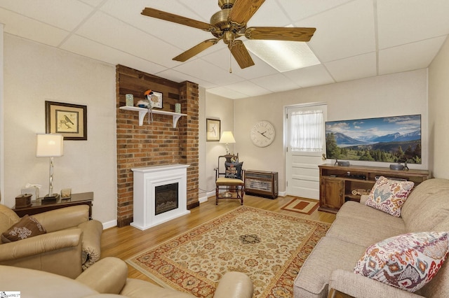 306 Verner Dr, Greenville, SC 29617 - living area featuring a ceiling fan, wood finished floors, a drop ceiling, and a large fireplace