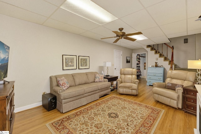 306 Verner Dr, Greenville, SC 29617 - living room featuring a drop ceiling, stairway, light wood-style floors, and ceiling fan