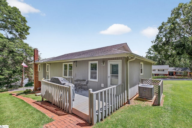 306 Verner Dr, Greenville, SC 29617 - back of property featuring a yard, a wooden deck, a chimney, and a shingled roof