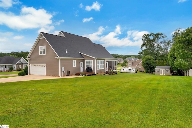 101 Edens Garden Way, Six Mile, SC 29682 - rear view of house featuring a garage, concrete driveway, a storage shed, and a lawn