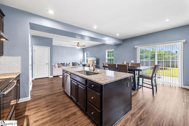 202 Huron Way, Greenville, SC 29607 - kitchen featuring appliances with stainless steel finishes, dark wood-style floors, open floor plan, light stone countertops, and ceiling fan