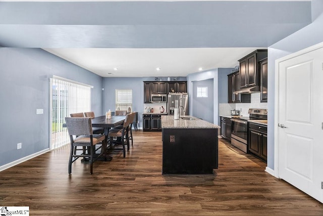 202 Huron Way, Greenville, SC 29607 - kitchen with appliances with stainless steel finishes, healthy amount of natural light, dark brown cabinetry, dark wood finished floors, and recessed lighting