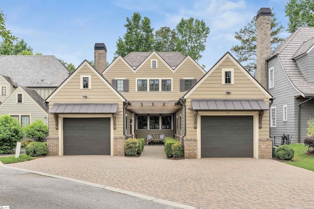 155 Village Point Dr, Sunset, SC 29685 - view of front facade with a chimney, a standing seam roof, decorative driveway, and brick siding