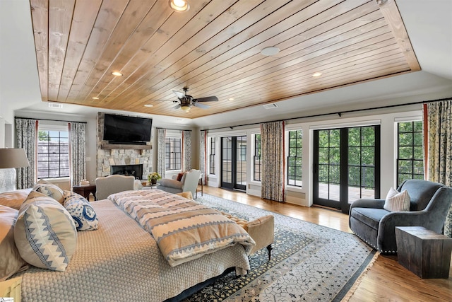 155 Village Point Dr, Sunset, SC 29685 - bedroom with wooden ceiling, access to outside, light wood-style floors, a stone fireplace, and french doors
