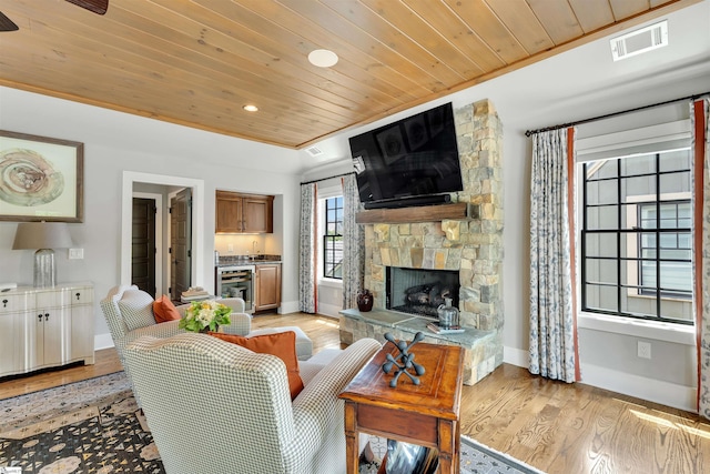 155 Village Point Dr, Sunset, SC 29685 - living room with wood ceiling, a fireplace, recessed lighting, light wood-style flooring, and wine cooler