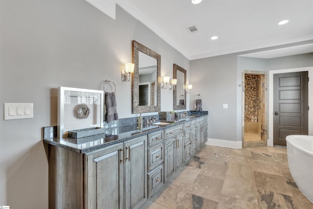 155 Village Point Dr, Sunset, SC 29685 - full bathroom featuring a soaking tub, double vanity, recessed lighting, tiled shower, and stone finish floors