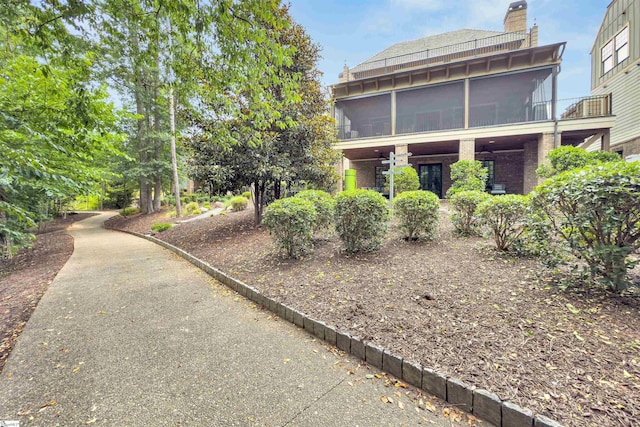 155 Village Point Dr, Sunset, SC 29685 - back of house featuring a sunroom and a chimney