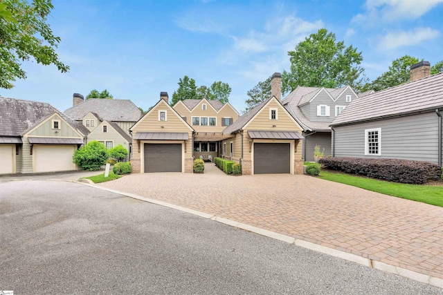 155 Village Point Dr, Sunset, SC 29685 - view of front of home featuring a standing seam roof, an attached garage, driveway, and a metal roof