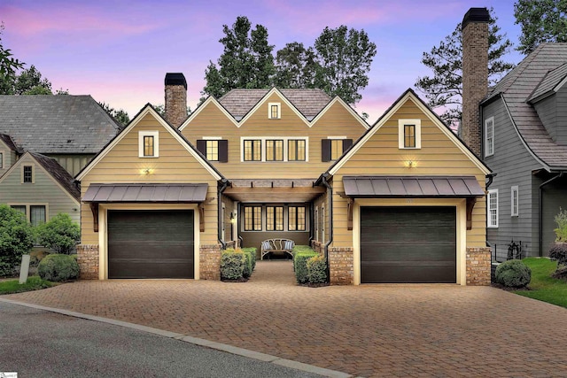 155 Village Point Dr, Sunset, SC 29685 - view of front of house with a standing seam roof, a chimney, stone siding, and driveway