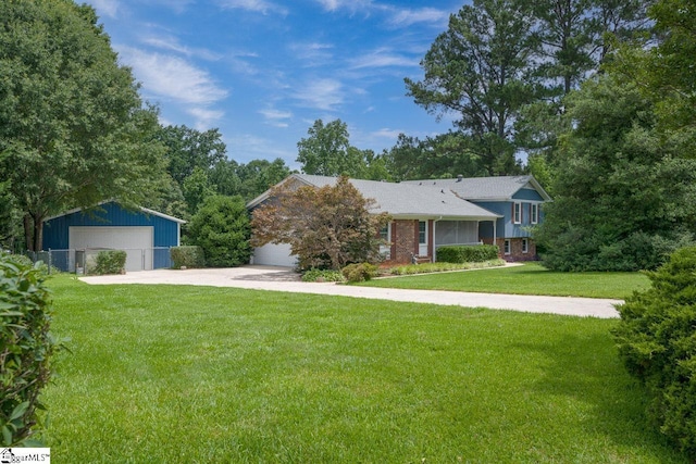14 Rollingreen Rd, Greer, SC 29651 - tri-level home featuring a garage, a front yard, an outdoor structure, and brick siding