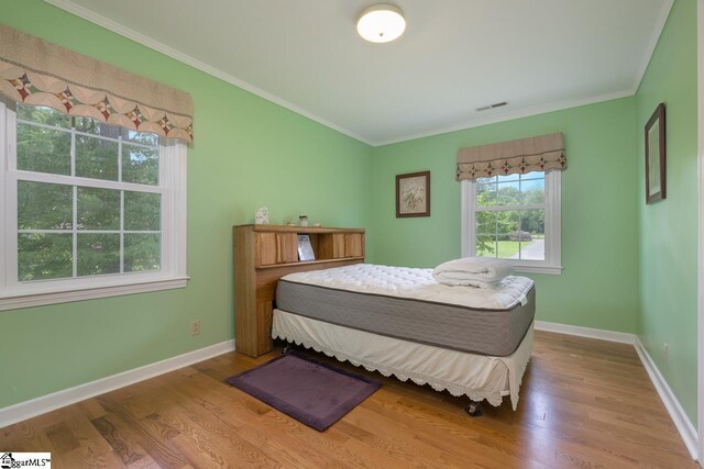 14 Rollingreen Rd, Greer, SC 29651 - bedroom with wood finished floors and ornamental molding