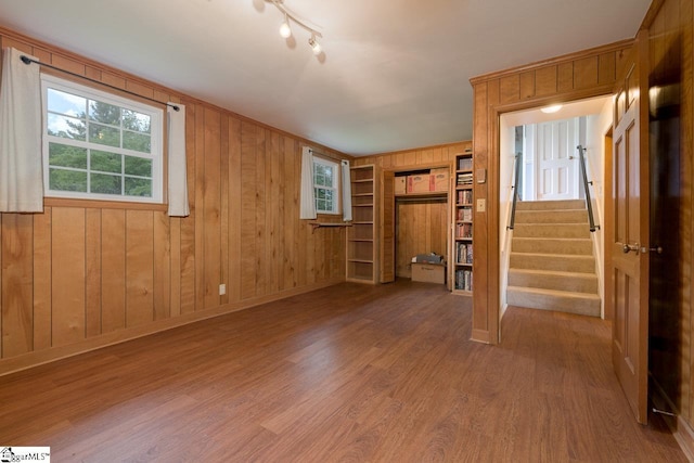 14 Rollingreen Rd, Greer, SC 29651 - spare room featuring wood finished floors, built in features, wooden walls, and stairs