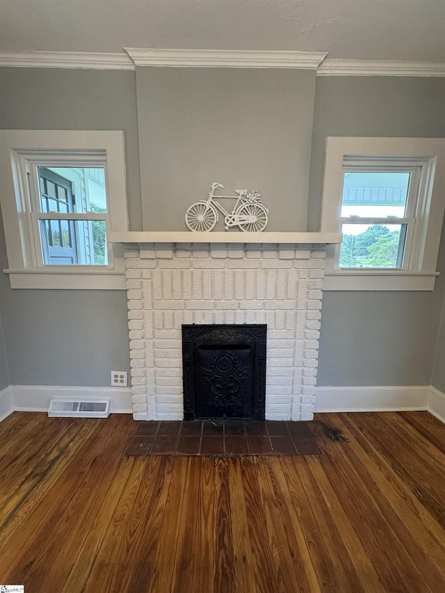 23 N Greenwood Avenue Extension, Ware Shoals, SC 29692 - detailed view of crown molding, a fireplace, and wood finished floors