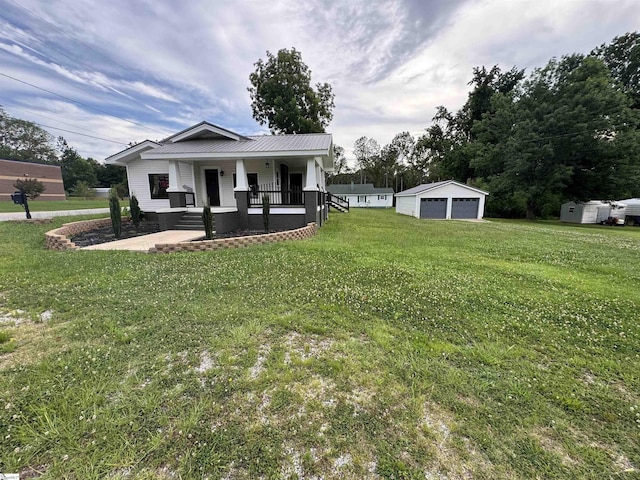 23 N Greenwood Avenue Extension, Ware Shoals, SC 29692 - view of front of home featuring a detached garage, covered porch, an outdoor structure, and a front lawn