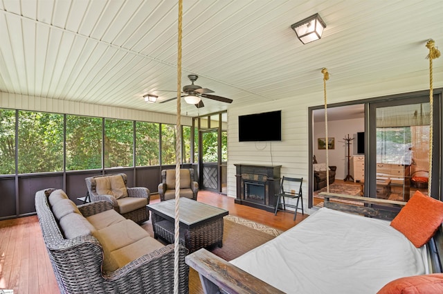 421 E Westbrooks Rd, Seneca, SC 29678 - sunroom with an outdoor living space with a fireplace and ceiling fan