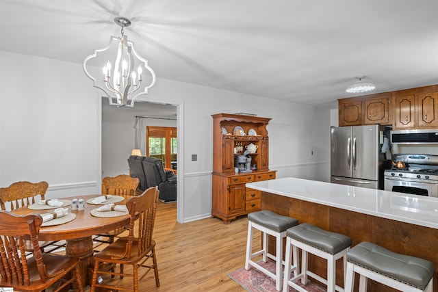 421 E Westbrooks Rd, Seneca, SC 29678 - dining space featuring light wood-style floors and a chandelier