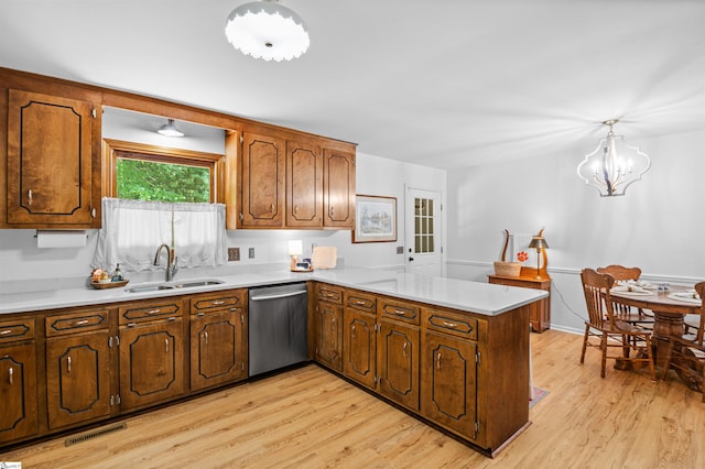 421 E Westbrooks Rd, Seneca, SC 29678 - kitchen featuring dishwasher, a peninsula, light wood-style flooring, and light countertops
