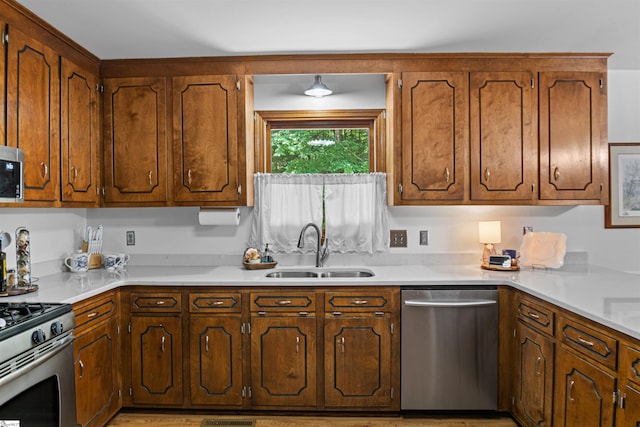 421 E Westbrooks Rd, Seneca, SC 29678 - kitchen with stainless steel appliances, light countertops, and brown cabinetry