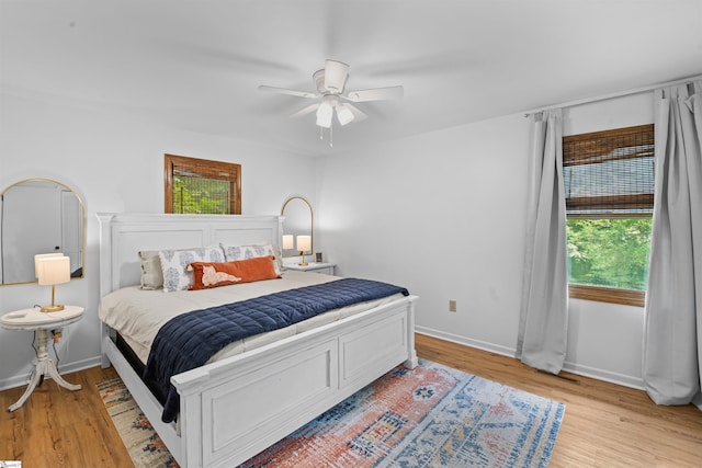 421 E Westbrooks Rd, Seneca, SC 29678 - bedroom featuring multiple windows, light wood-style floors, and ceiling fan