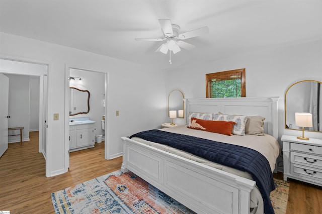 421 E Westbrooks Rd, Seneca, SC 29678 - bedroom featuring light wood-style floors, ceiling fan, and ensuite bathroom