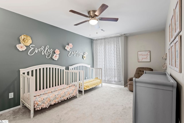 522 Reid School Rd, Taylors, SC 29687 - carpeted bedroom featuring a nursery area and ceiling fan