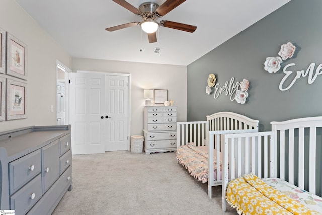 522 Reid School Rd, Taylors, SC 29687 - carpeted bedroom with a crib, a closet, and a ceiling fan