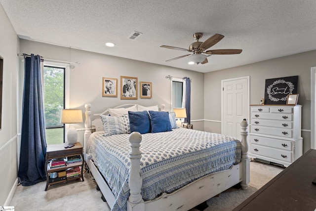 522 Reid School Rd, Taylors, SC 29687 - bedroom with light colored carpet, a textured ceiling, and a ceiling fan