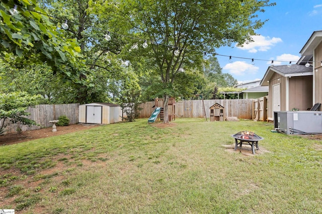 522 Reid School Rd, Taylors, SC 29687 - fenced backyard with an outdoor fire pit, a shed, and a playground