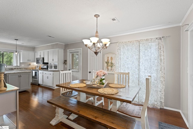 522 Reid School Rd, Taylors, SC 29687 - dining room featuring dark wood finished floors, a chandelier, a textured ceiling, and ornamental molding