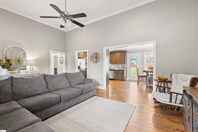 417 Addison Cir, Pelzer, SC 29669 - living area with ornamental molding, ceiling fan, light wood-style floors, and a towering ceiling