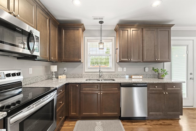 417 Addison Cir, Pelzer, SC 29669 - kitchen with appliances with stainless steel finishes, crown molding, wood finished floors, recessed lighting, and light stone counters
