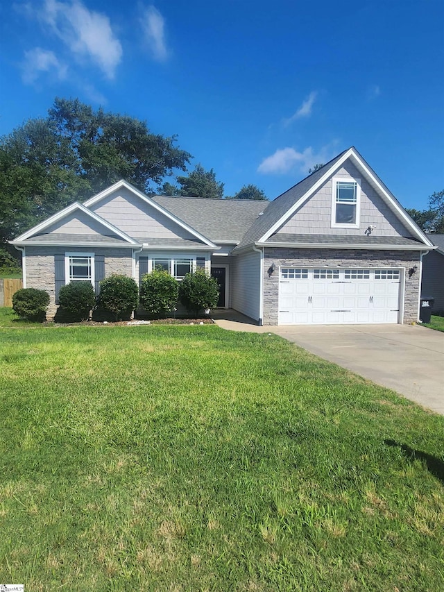 1039 Blythwood Dr, Piedmont, SC 29673 - view of front of property with driveway, a front yard, an attached garage, and stone siding