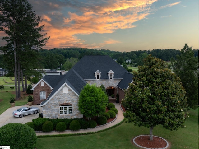 28 Laurel Crest Ln, Travelers Rest, SC 29690 - view of front of home featuring stone siding, a lawn, concrete driveway, and brick siding