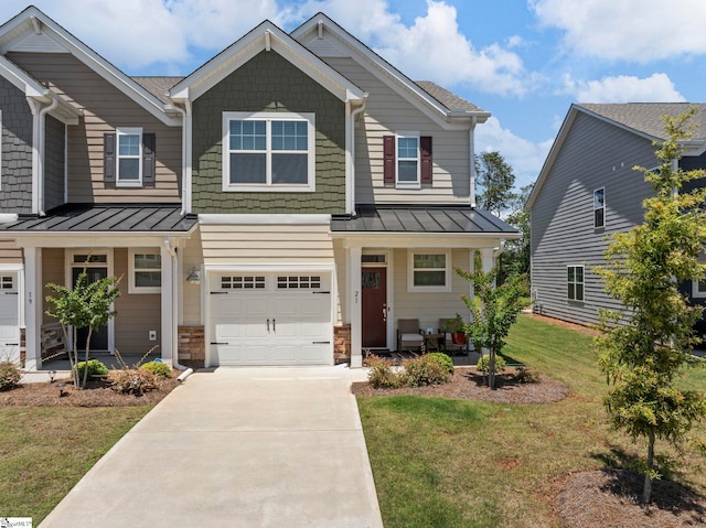 21 Gaskins Trl, Travelers Rest, SC 29690 - craftsman-style home featuring a standing seam roof, a porch, an attached garage, driveway, and a front yard
