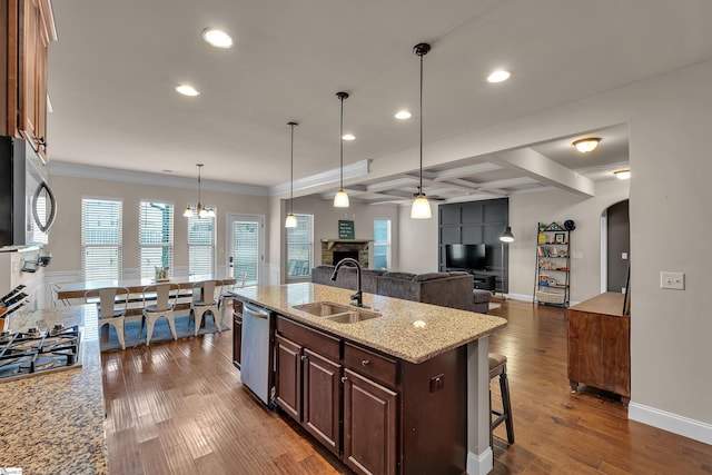 412 Aschoff Ct, Simpsonville, SC 29680 - kitchen with ceiling fan, a fireplace, appliances with stainless steel finishes, recessed lighting, and a kitchen breakfast bar