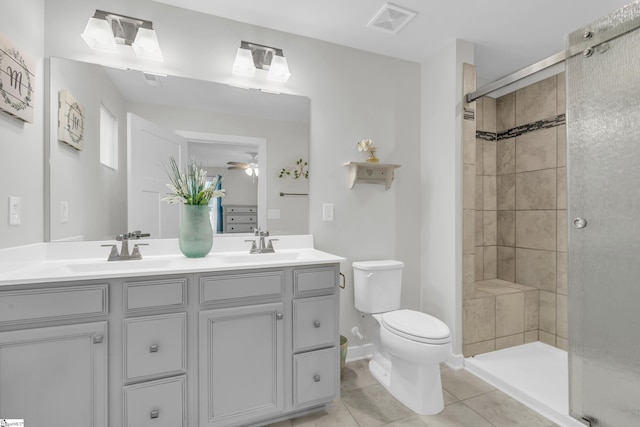 118 Sylvester St, Fountain Inn, SC 29644 - bathroom featuring double vanity, a tile shower, ceiling fan, and tile patterned flooring