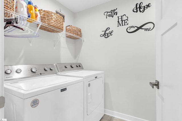 118 Sylvester St, Fountain Inn, SC 29644 - laundry area with washer and clothes dryer and light tile patterned floors