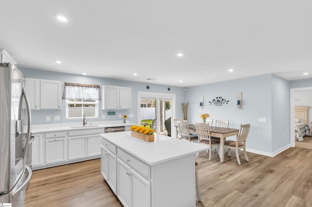 118 Sylvester St, Fountain Inn, SC 29644 - kitchen with stainless steel fridge, a center island, plenty of natural light, light wood-type flooring, and recessed lighting