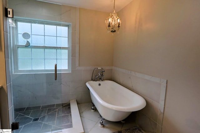 11 Hickory Hollow Ct, Greenville, SC 29607 - bathroom with a soaking tub, a chandelier, tile walls, tiled shower, and a wainscoted wall