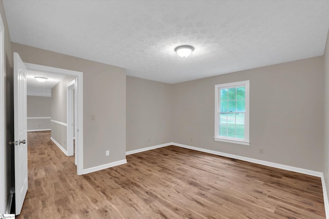 10628 Augusta Rd, Belton, SC 29627 - empty room with wood finished floors and a textured ceiling