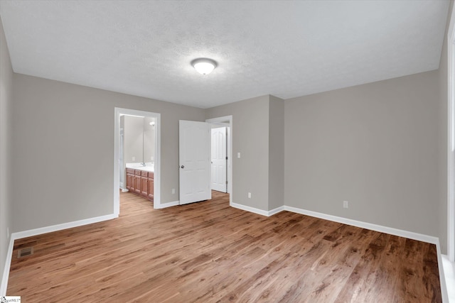 10628 Augusta Rd, Belton, SC 29627 - empty room featuring light wood-style flooring and a textured ceiling