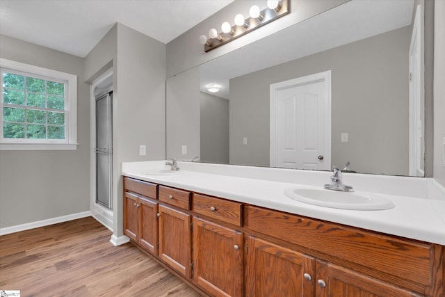 10628 Augusta Rd, Belton, SC 29627 - full bath featuring double vanity, wood finished floors, and a shower with door