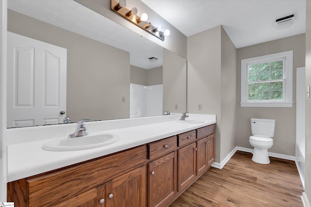 10628 Augusta Rd, Belton, SC 29627 - bathroom with double vanity and wood finished floors