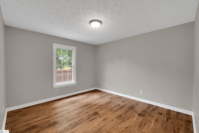 10628 Augusta Rd, Belton, SC 29627 - unfurnished room with wood finished floors and a textured ceiling