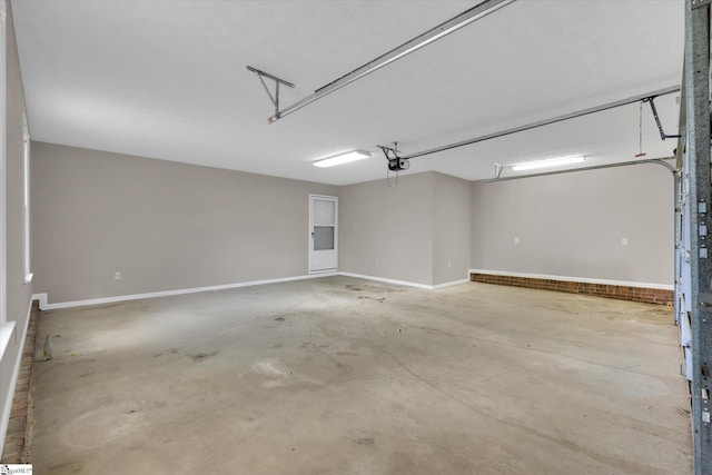 10628 Augusta Rd, Belton, SC 29627 - garage with a garage door opener and baseboards