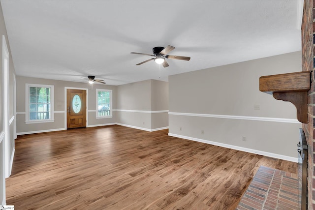 10628 Augusta Rd, Belton, SC 29627 - unfurnished living room with a ceiling fan and wood finished floors