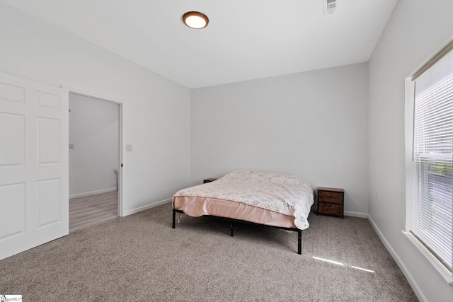 904 W Hampton St, Laurens, SC 29360 - carpeted bedroom featuring multiple windows
