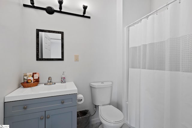 904 W Hampton St, Laurens, SC 29360 - bathroom featuring vanity, marble finish floors, and a shower with curtain